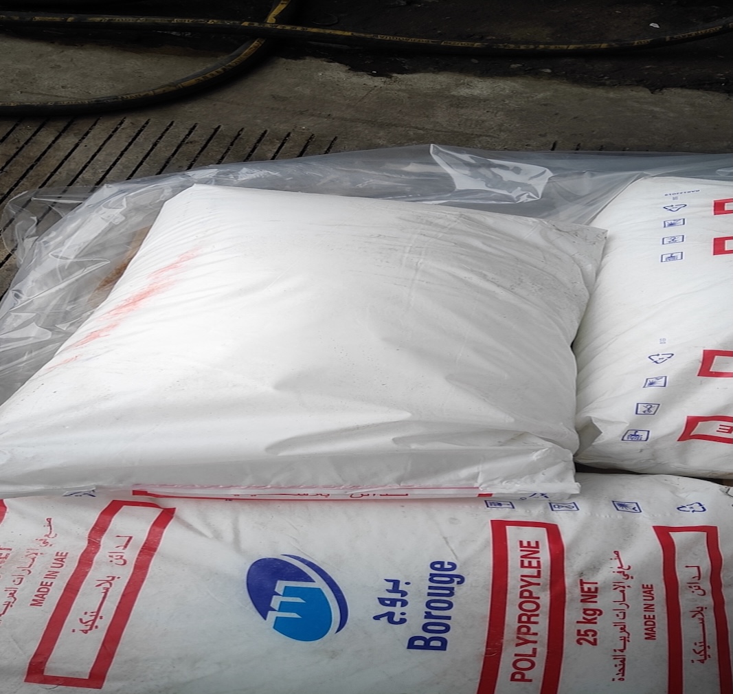 Stacked-Borouge-polypropylene-raw-material-sacks-warehouse-bulk-inventory-shot